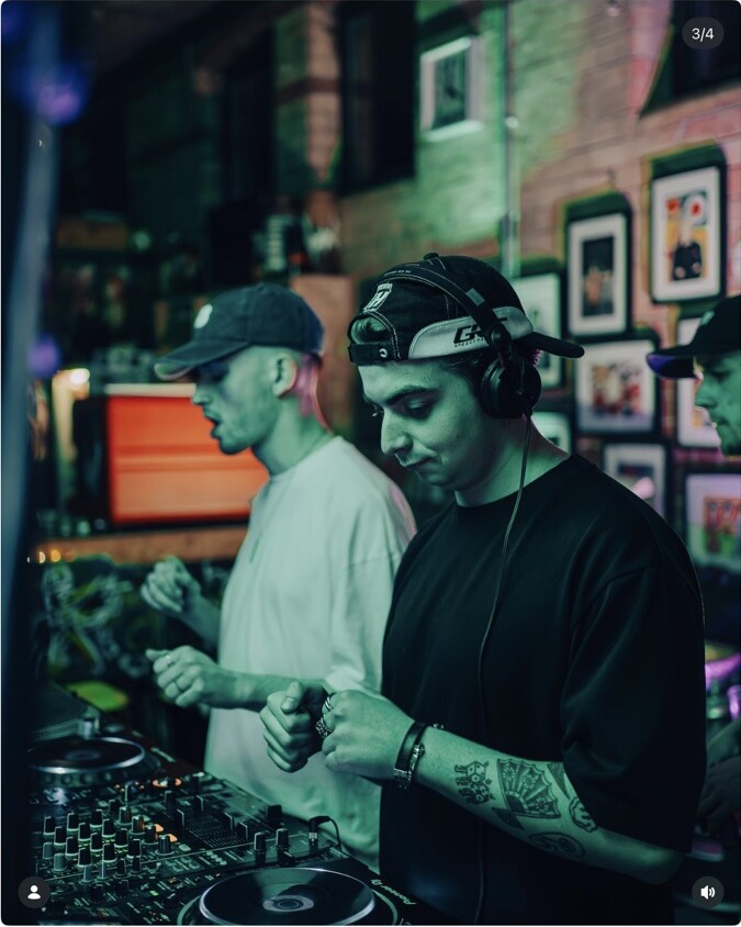 Two DJs performing at a Vibrant pop-up night