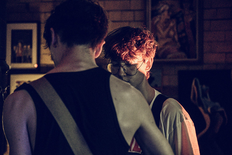 Two musicians sharing a moment during a live performance